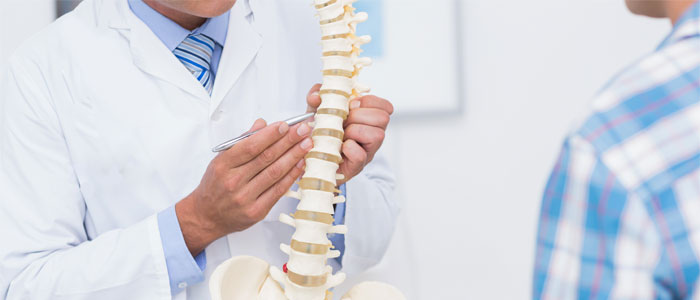 chiropractor explaining herniated disc to patient